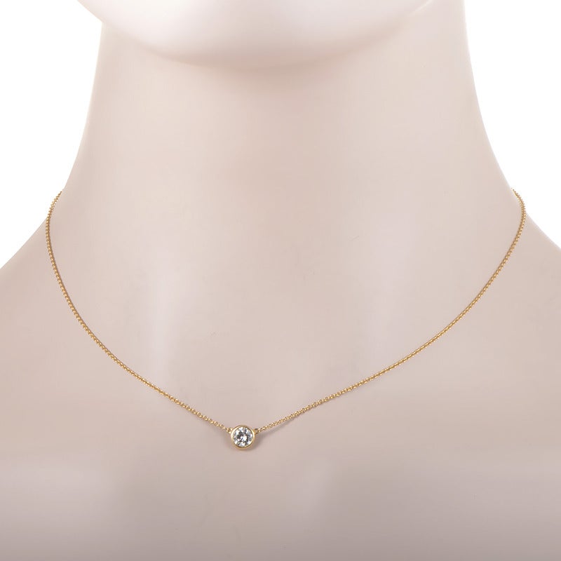 World renowned, and loved by many, the Diamonds by the Yard collection is one of Elsa Peretti's most famous. This pendant necklace is quite simple, made of yellow gold and boasting only a single ~.50ct diamond pendant.

Approximate Dimensions:
