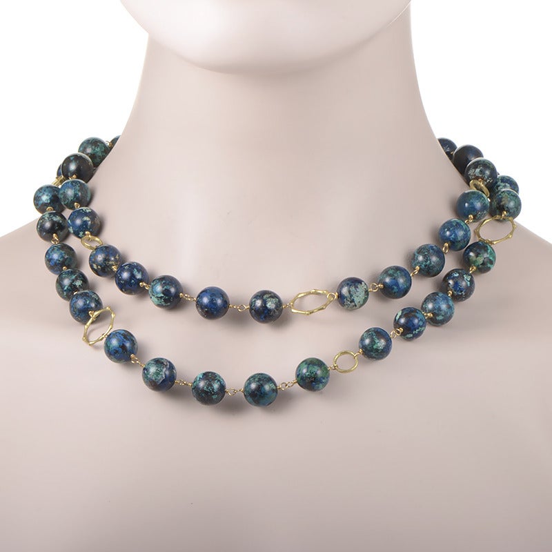 A wonderful design from Dominique Cohen featuring attractive azurite stone beads joined into a stylish necklace by splendidly crafted 18K yellow gold elements.