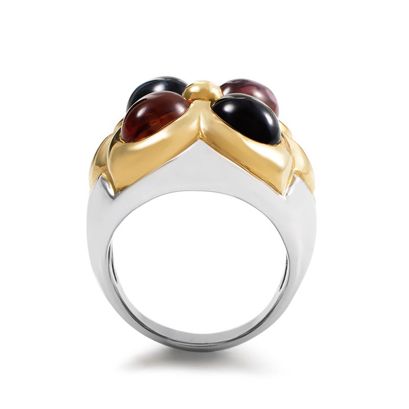 Playfully placed colorful cabochons are the main attraction in the design of this Bulgari ring. The ring is made primarily of 18K white gold and is accented with yellow gold set with four gemstone cabochons.
Ring Size: 5.5