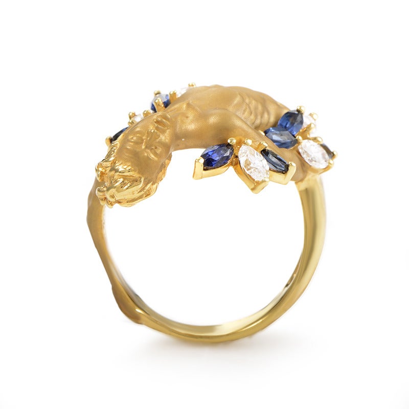A fabulously designed Carrera y Carrera ring made of 18K yellow gold, accented with exceptional diamond and sapphire stones giving the piece an intriguing, vivacious look. The diamonds weigh 0.50ct and the sapphires 0.50ct as well.
Ring Size:8.0