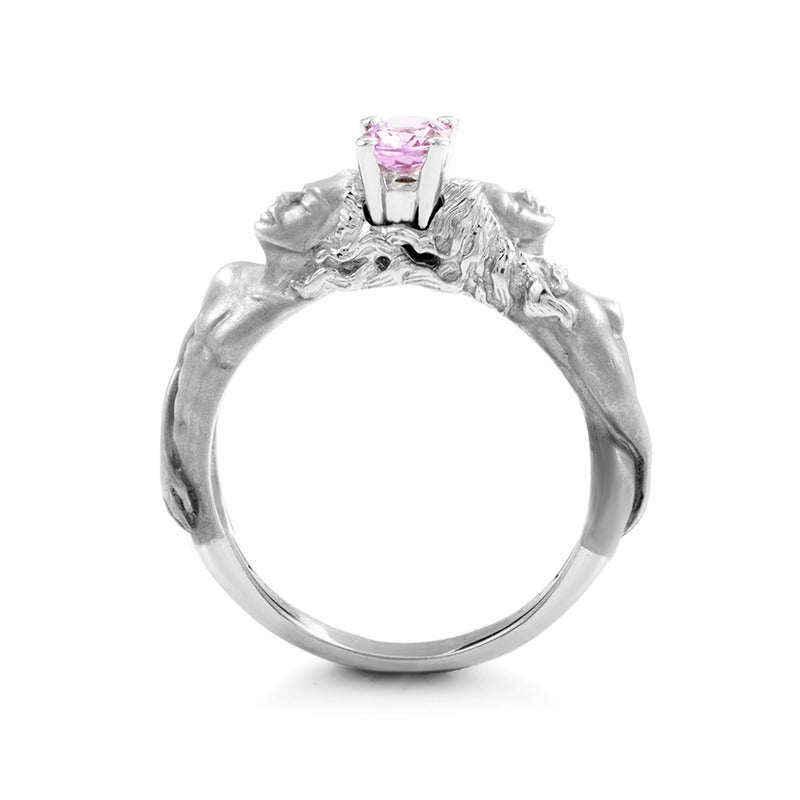 Treat yourself or surprise a loved one with this gorgeous Carrera y Carrera ring, a glorious homage to love and passion between a man and a woman. Delightfully crafted from 18K white gold, the bodies are accented with a marvelous pink sapphire stone