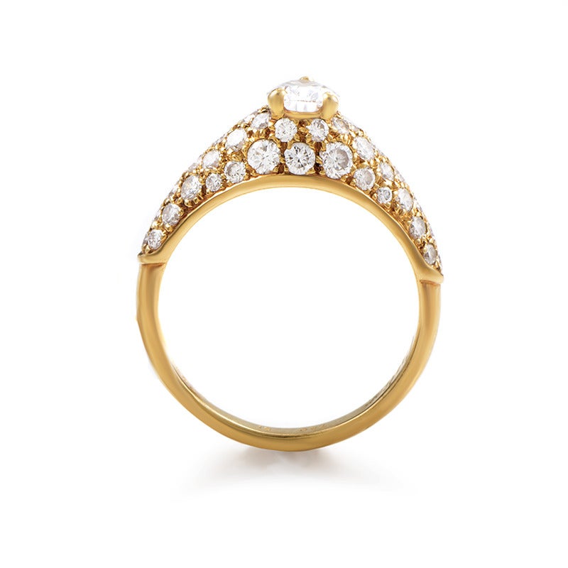This splendid luxurious Cartier piece is remarkably made from 18K yellow gold and lavishly set with 1.50 carats of diamonds making a wonderful base for the spectacular 0.62ct pear-shaped main stone.

Ring Size: 5.75 (50 7/8)
