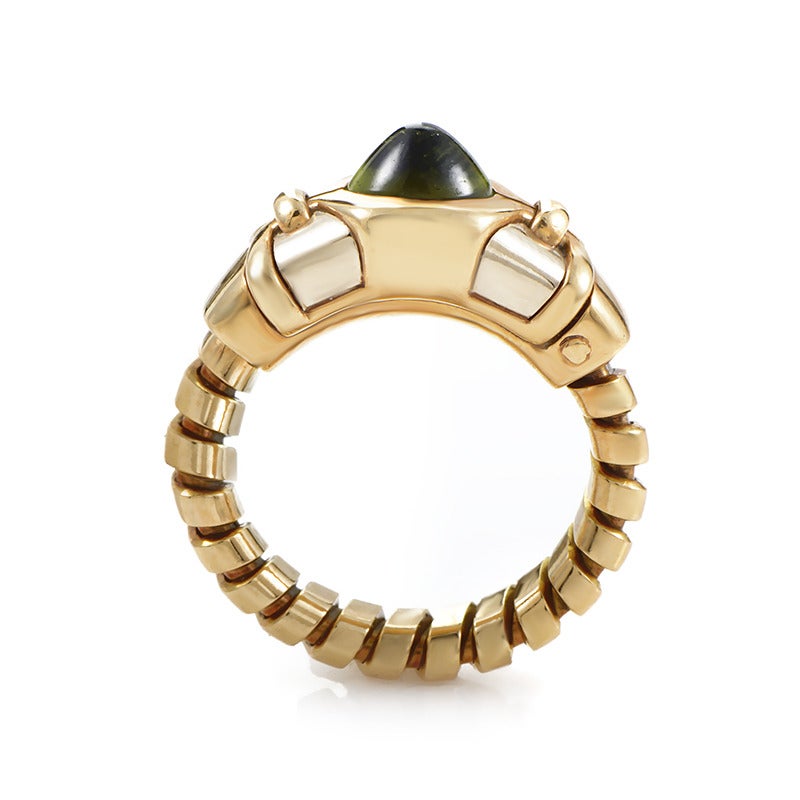 Vibrant design combined with exemplary craftsmanship characterizes this Bulgari masterpiece; the ring is made of 18K yellow and white gold and boasts a memorable green tourmaline stone.
Ring Size: 4.75-10.0