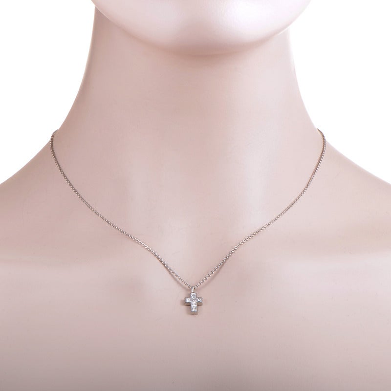 Tasteful and prestigious-looking, this lovely Cartier necklace made of exemplary platinum features splendidly crafted cross pendant set with six square-cut diamond stones, totaling 0.55ct.

Approximate Dimensions: Drop of the Necklace: 9.50