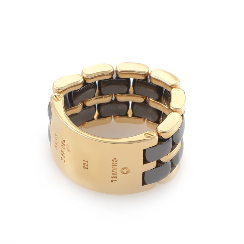 Featuring bold, memorable design, this exquisite Chanel band will complement delightfully any fashionable look; it’s made of stylish 18K yellow gold and accented with hematite stones.

Ring Size: 6.75 (53 3/8)