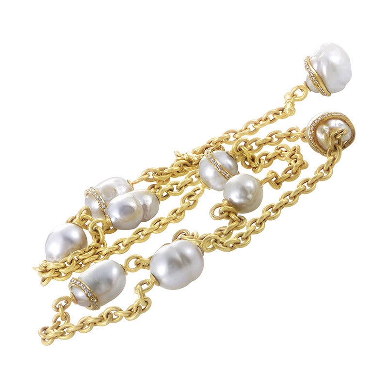 Pearls, with their aura of rarity and uniqueness, give an attractive touch to any jewelry piece and it is no different with this exemplary necklace made of elegant 18K yellow gold, accented with lovely pearls and 2.50 carats of sparkly diamonds.