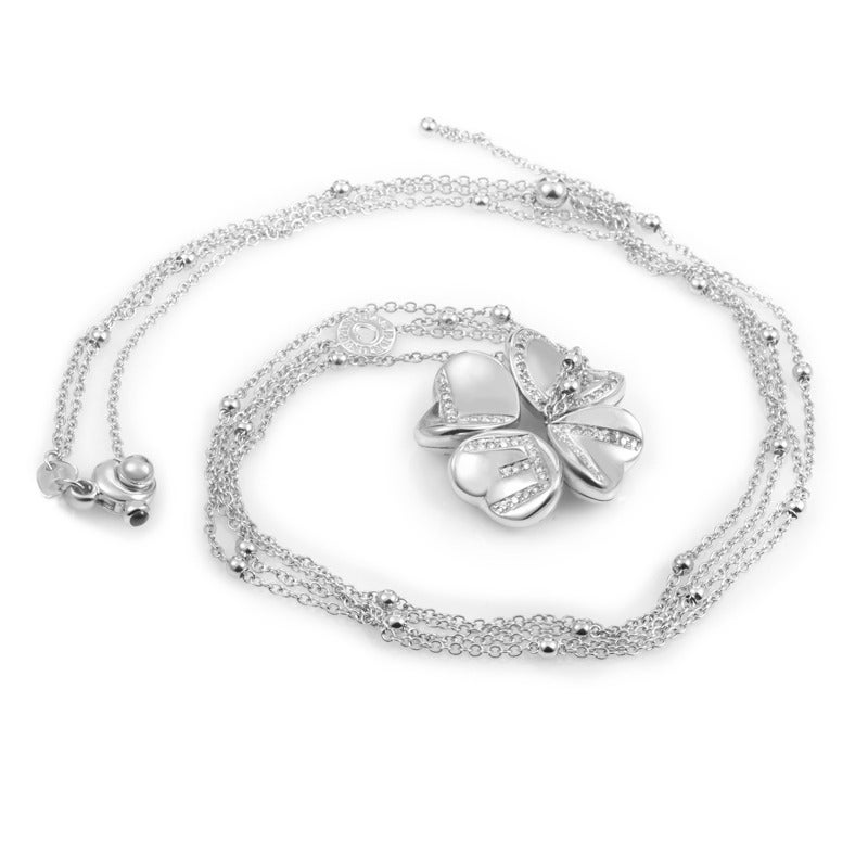 Stylish and feminine, this fabulous Pasquale Bruni necklace is made of prestigious 18K white gold and boasts splendidly crafted 27” double rolo chain accented with beads, onto which a lovely pendant is attached, depicting a four-leaf clover which is