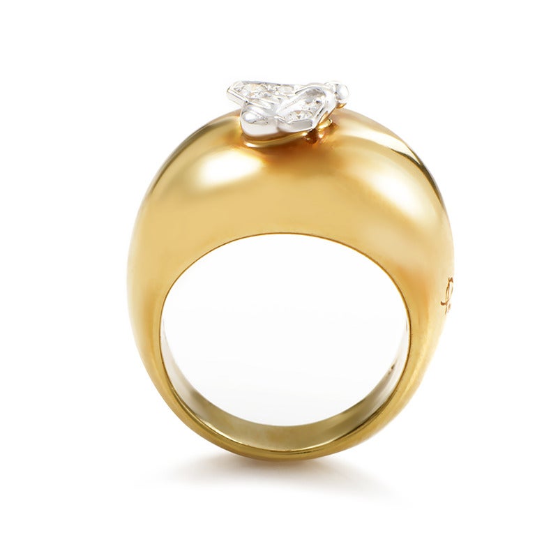 A one-of-a-kind design by the celebrated Pomellato crafted to perfection, with smooth, elegant lines presenting the best of the exemplary 18K yellow gold used for making the body of the ring; it features a single accent in 18K white gold set with