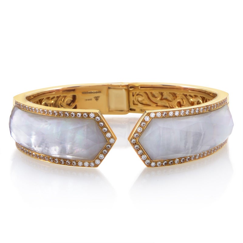 A spectacularly designed Stephen Webster cuff made of 18K yellow gold, boasting mother of pearl accented with white quartz. Lastly, the quartz is framed with 1.34 carats of glittering diamonds.

Included Items: Manufacturer's Box