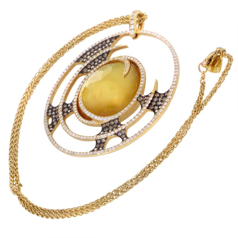 A gorgeous Stephen Webster necklace wonderfully made from 18K yellow gold, featuring stylish vortex pendant set with 2.71 carats of diamonds and accented with black rhodium-plated elements; its most magnificent detail is an incredible centerpiece