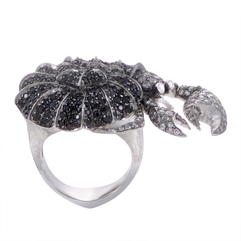 Another offbeat design by Stephen Webster, this ring consists of an impeccably crafted 18K white gold body and stunning decoration in the shape of a hermit crab made of bronze, embellished with diamonds weighing in total 1.38 carats and 3.51 carats