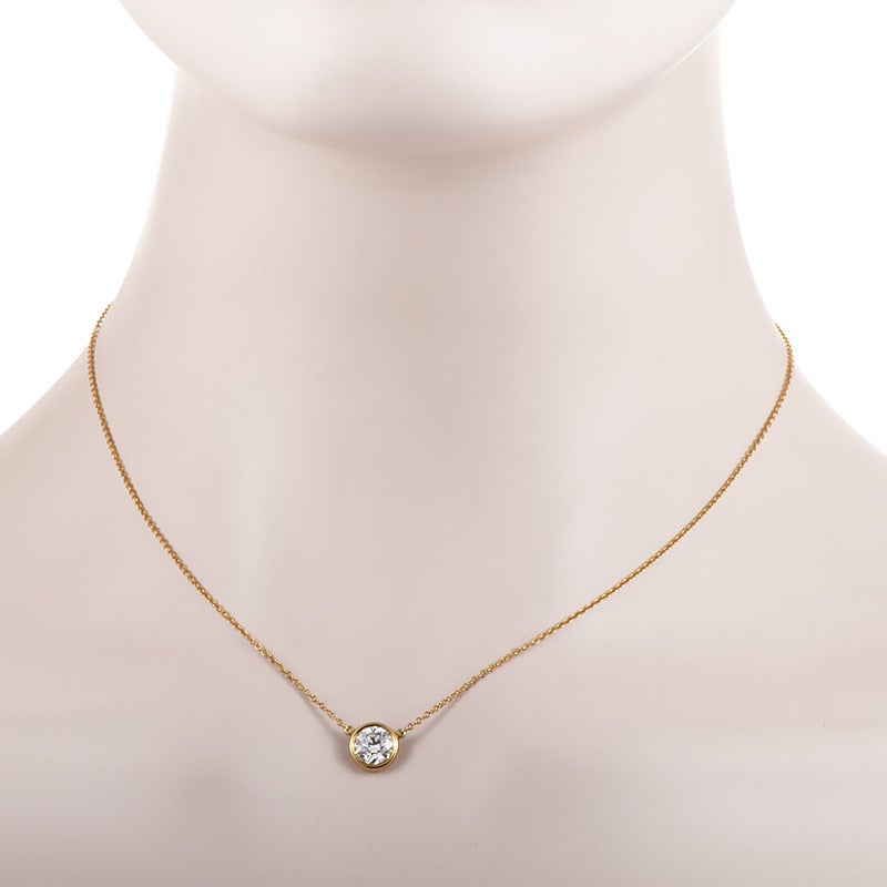 Classic and prestigious, this gorgeous 18K yellow gold necklace from Tiffany & Co. by Elsa Peretti features timeless design perfect for any occasion. The centerpiece of the necklace is the very slightly included, nearly colorless 1.25-carat diamond