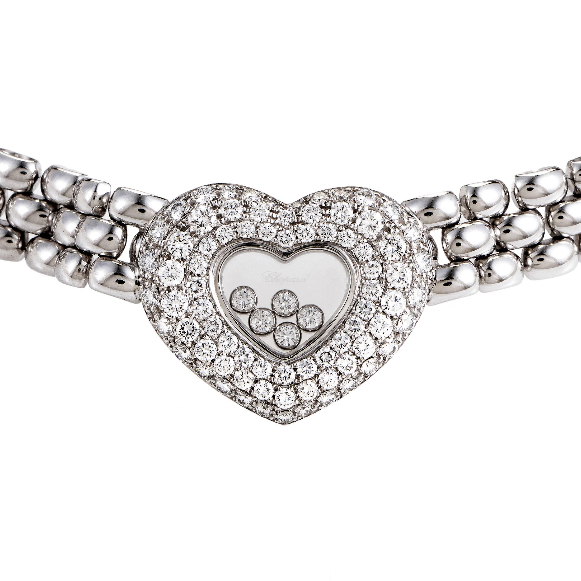 A scintillating and compelling visual effect is produced by the fantastic interplay of immaculately polished 18K white gold links in this astounding necklace from Chopard while glistening diamonds emphasize the romantic heart-shaped pendant which