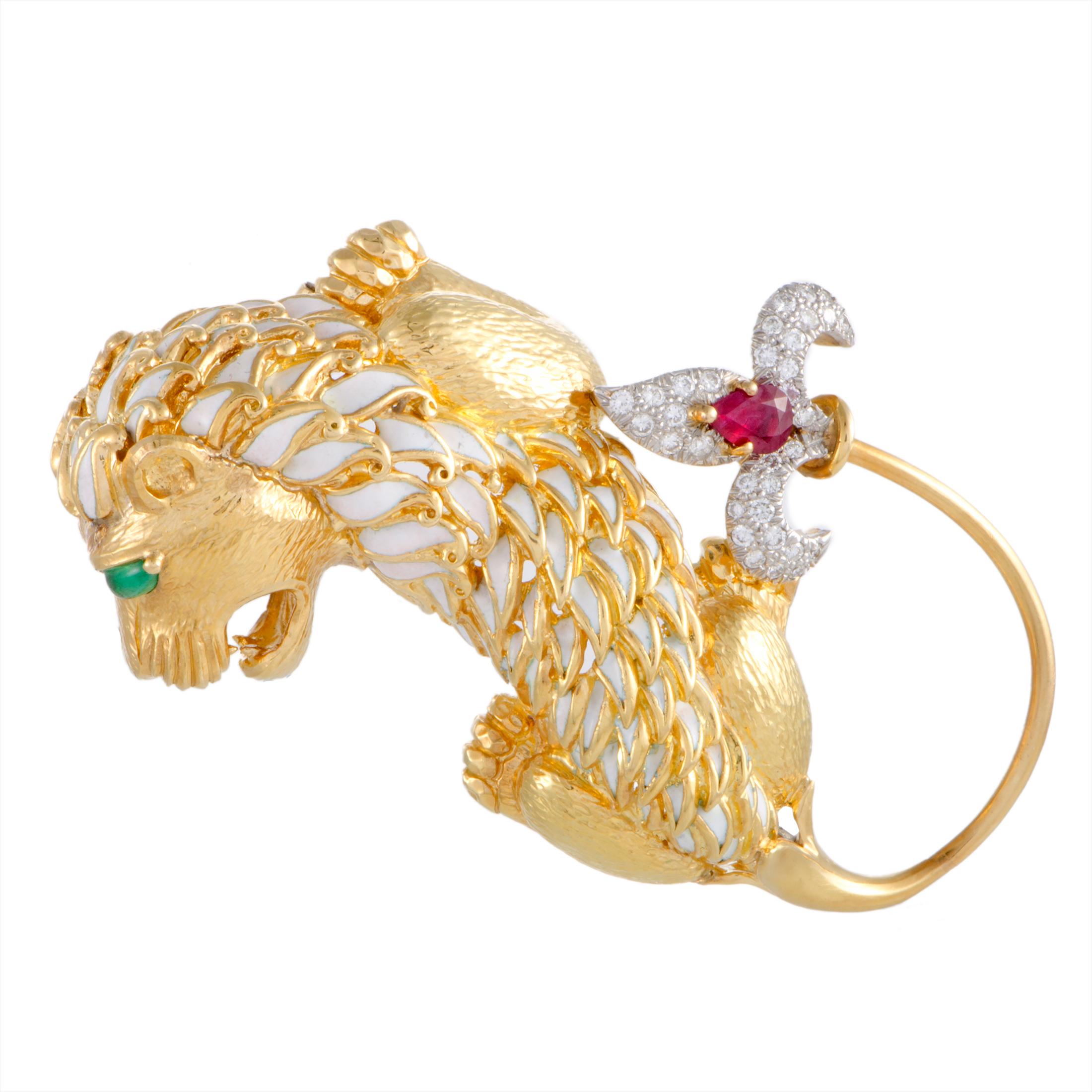 Add a compelling accent to your ensembles with this incredible lion pin that is extraordinarily designed by David Webb and exquisitely crafted from 18K yellow and 18K white gold. The pin is decorated with an attractive blend of diamond, ruby, and