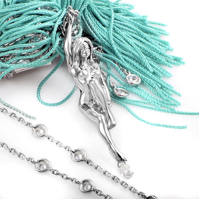 Sexy yet subtle, this distinctive pendant necklace from Boucheron is sure to catch a lot of attention. The necklace is made of 18K white gold studded with briolette diamonds. The main attraction however, is a long, aquamarine-colored tassel pendant