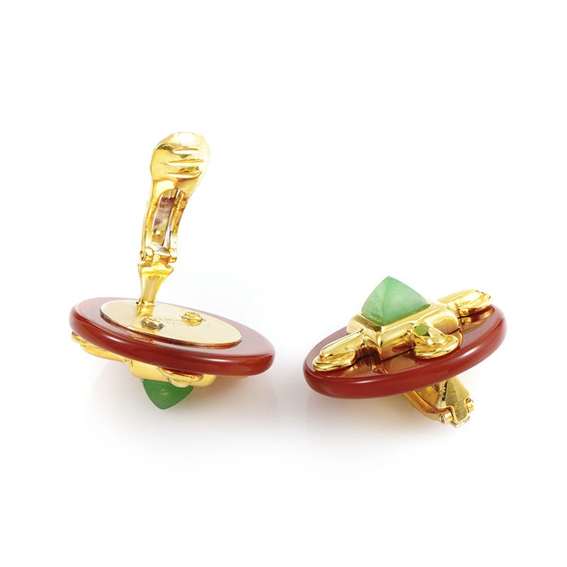 Creatively designed earrings from Cartier made of splendid 18K yellow gold, boasting attractive carnelian and spectacular jade accents.