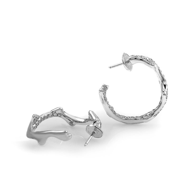 Another stylish addition to the imaginative Bois de Rose collection by Dior; these elegant earrings are made of prestigious 18K white gold and are embellished with delightfully processed diamond stones.

Included Items: Manufacturer's Box