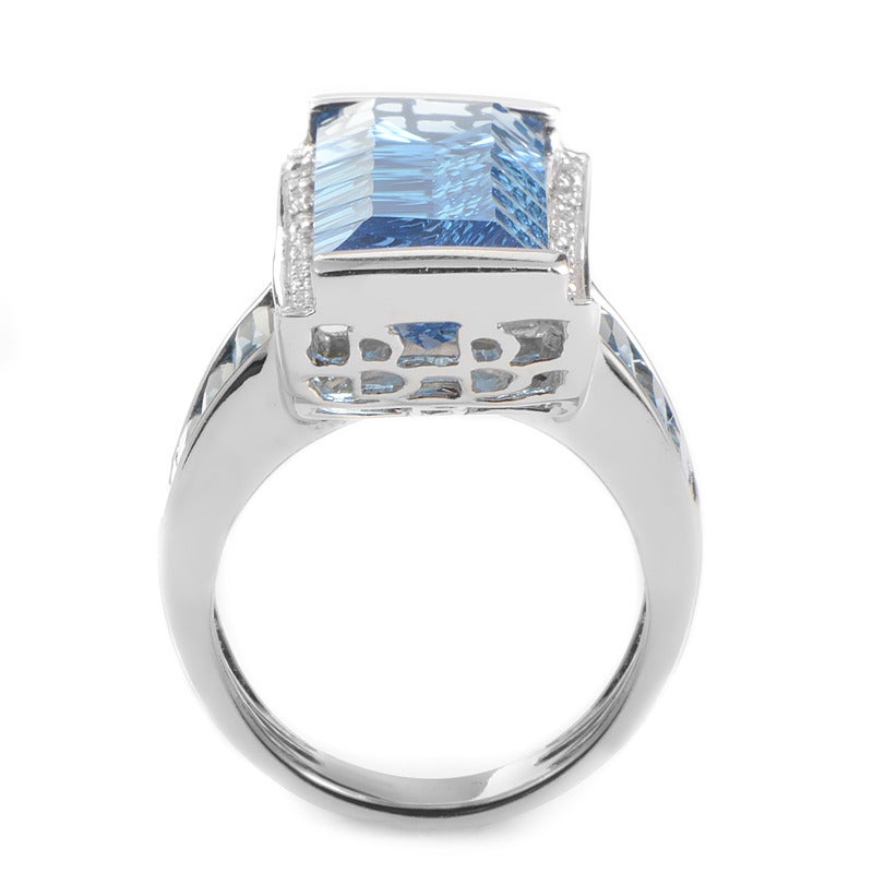 This ring from our French collection is sure to dazzle with its sensuous blue design. The ring is made of 18K white gold and boasts ~18.18ct of blue topaz in its design accented with diamonds.

Ring Size: 7.0 (54)
Diamond Carat Weight: 0.29