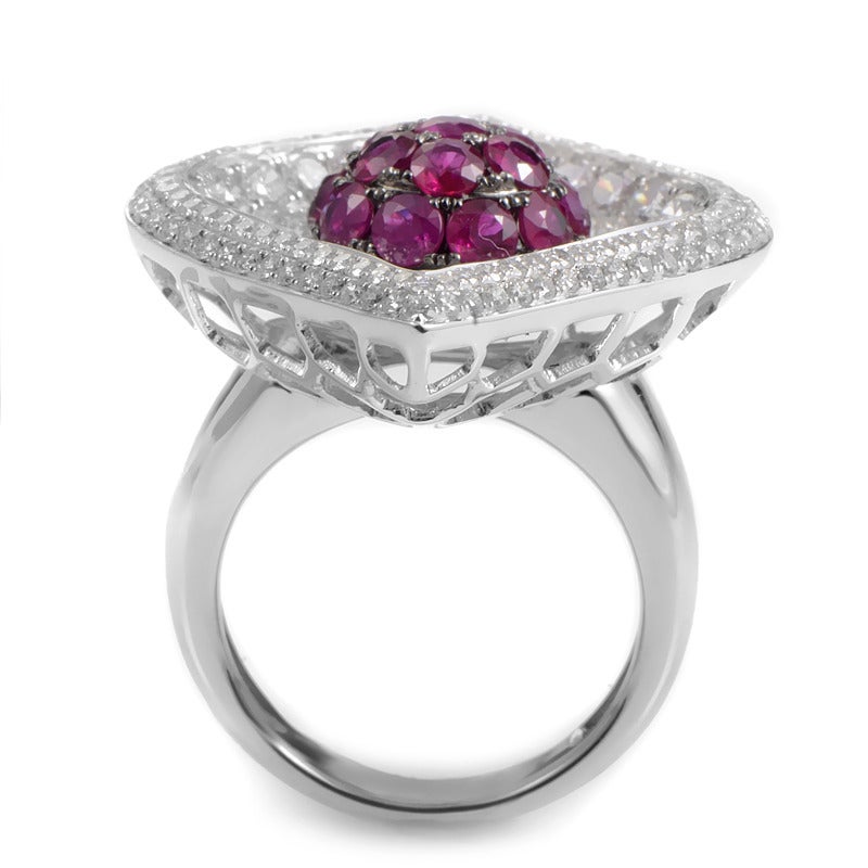 Prepare to dazzle everyone around you as you don this lavish gemstone ring from our French Collection. The ring is made of 18K white gold and features a leaf-shaped motif set with a fantastic diamond pave. Lastly, a dome-shaped accent in the center