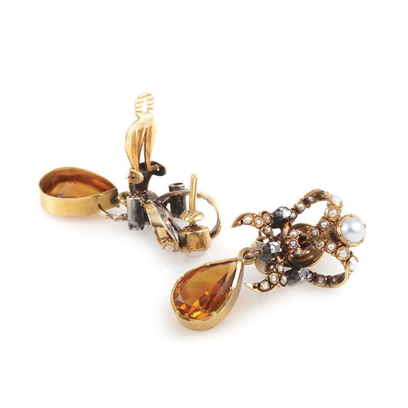 Marvelously designed pair of earrings made of attractive 18K yellow gold, stylishly decorated with pearls, diamonds and gorgeous citrine stones accompanying delightfully the warm tone of the gold.
Diamond Carat Weight: 0.20