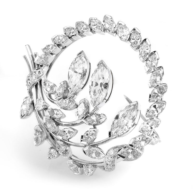 This fantastic antique brooch is a one-of-a-kind design that is fit for a queen! This spellbinding platinum design is especially unique because it is multi-functional serving as either a brooch or a pendant. It is made of platinum and is entirely