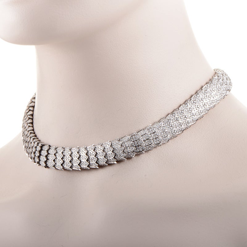 From celebrated Roberto Coin comes this spectacular jewelry piece, the essence of luxury and high-class glamour; the necklace is made of prestigious 18K white gold and features striking cobra-inspired design, lavishly paved with gorgeous diamonds