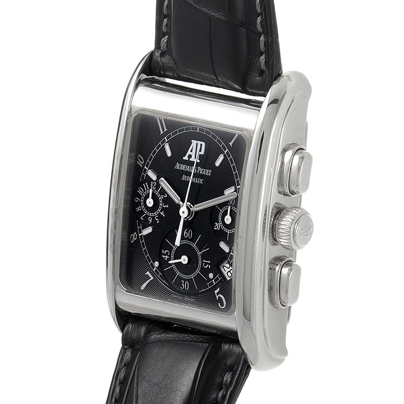 Audemars Piguet gents' 18K white gold automatic wristwatch with matching bezel on a black crocodile leather strap. Watch displays indication of hours, minutes, seconds, date and a chronograph feature on a black dial. Watch resists water to ~30