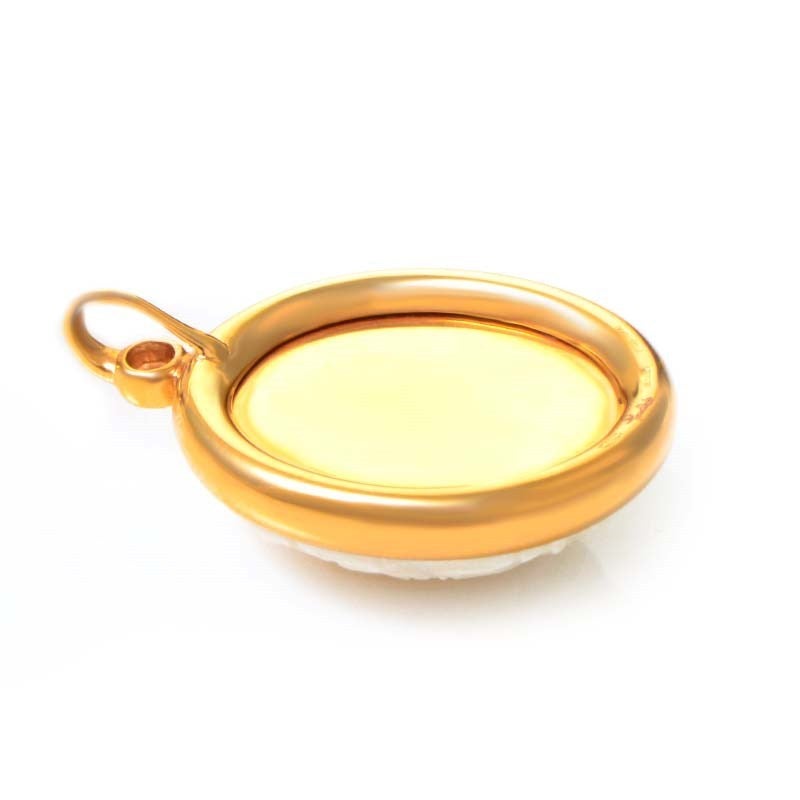 This pendant from Pomellato has an exotic look and feel due to the inclusion of a gorgeously carved white coral stone. The coral is held in 18K yellow gold, and for a bit of added luxury, is accented with a single white diamond.
Retail Price: