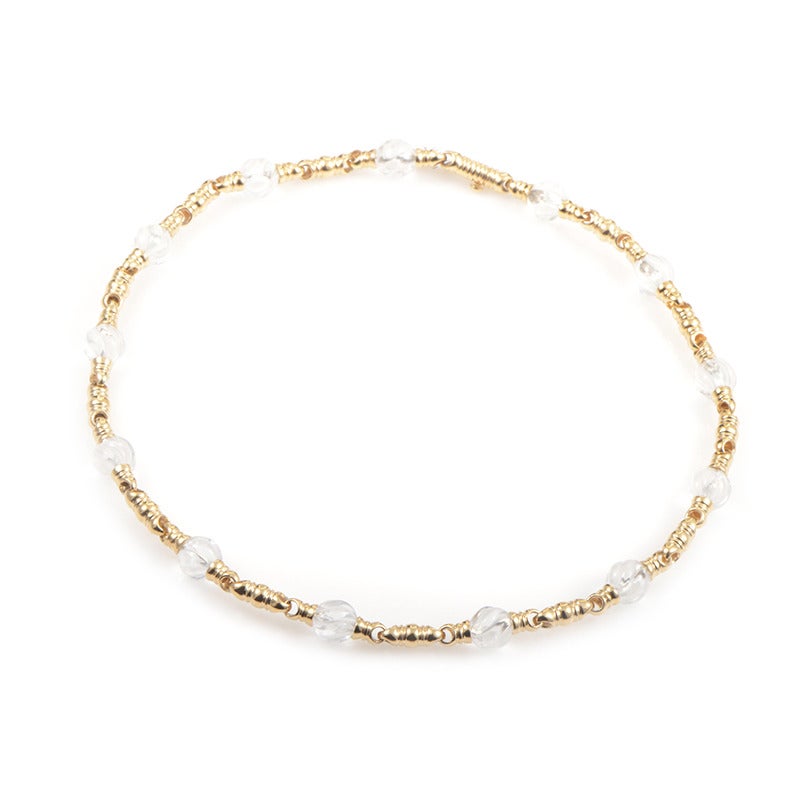 This delightful necklace from Boucheron draws its fantastic beauty from the dazzling 18K yellow gold chain contrasted splendidly by the adorable white quartz stones.
