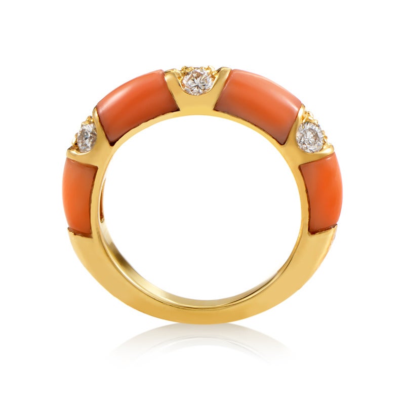 With the spotless surface of pink coral stones aligned perfectly with the polished surface of the 18K yellow gold, this ring boasts smooth, feminine appearance enriched with 0.40ct of diamonds.

Ring Size:4.5 (47 3/4)