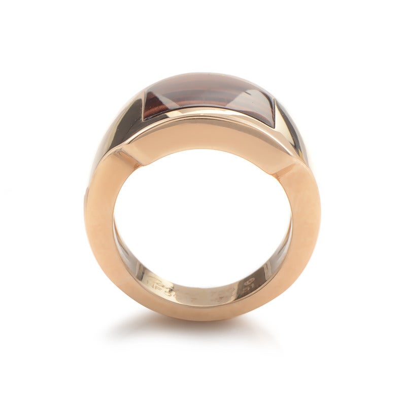 A sophisticated, neat appearance of this pleasing ring from Cartier is achieved through blending impeccably polished 18K rose gold with a smooth tiger eye stone.
Ring Size:5.75 (50 7/8)