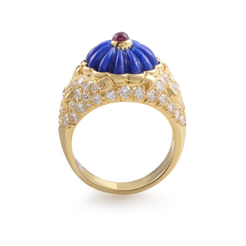 Evolving from the bottom up, this marvelous 18K yellow gold ring by Harry Winston features approximately 1.50 carats of subtle diamonds laying a wonderful foundation for the almost hypnotic lapis stone and the delicate ruby on top.

Ring Size:6.0