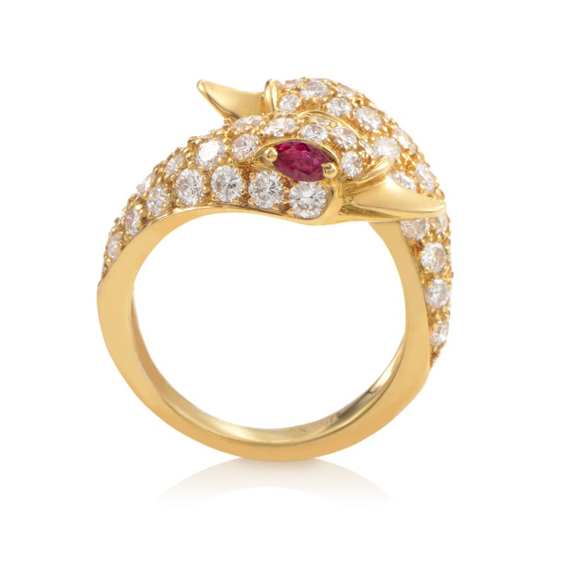 The 18K yellow gold body of this offbeat ring from Piaget evolves upwards into two lovely swan heads set with 1.50 carats of diamonds, additionally accented with gorgeous ruby stones for eyes.
Ring Size:3.75 (45 7/8)