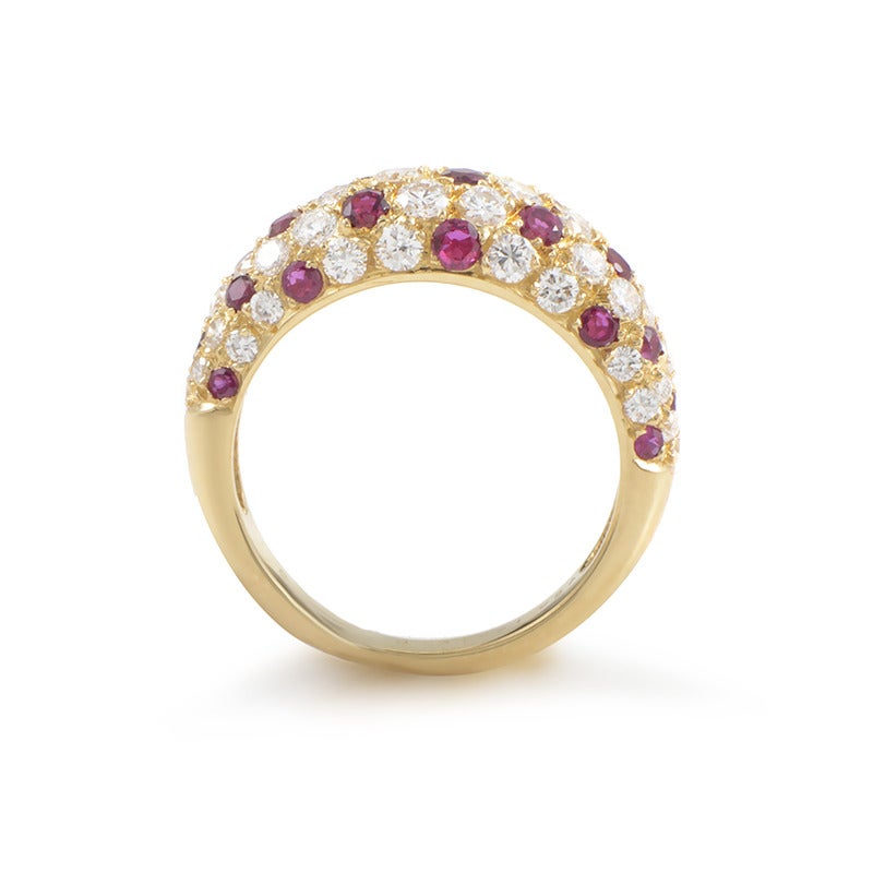 With a wonderful, gleaming combination of approximately 1.50 carats of diamonds and wonderfully spread rubies, this attractive 18K yellow gold ring from Van Cleef & Arpels boasts an enchanting, feminine look.
Ring Size:5.5 (50 1/4)