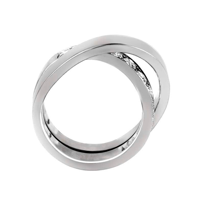 Cartier has created another masterpiece with this unique band ring from the Paris Nouvelle Vague collection. The ring is made of a single band subtly intertwined to give the illusion of multiple bands. Lastly, the ring is semi-paved with ~1ct of