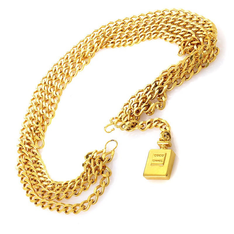 With a jaunty, multiple-fold chain setting a wonderful, strong tone for the entire piece, this magnificent belt by Chanel boasts a stunning COCO CHANEL dangling perfume bottle accent; a nod to the brand's rich perfume history and the perfect