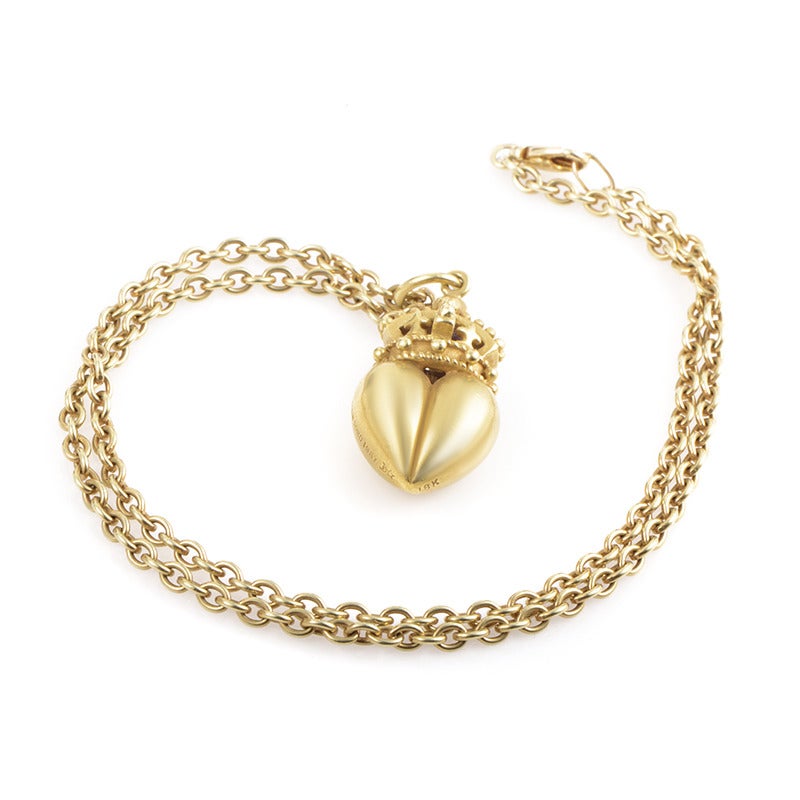 Attached to the classically designed rolo chain of this charming necklace from Kieselstein-Cord, the majestic 18K yellow gold pendant features crown-shaped accent upon a three-dimensional heart decor.

Approximate Dimensions:Drop of the Necklace: