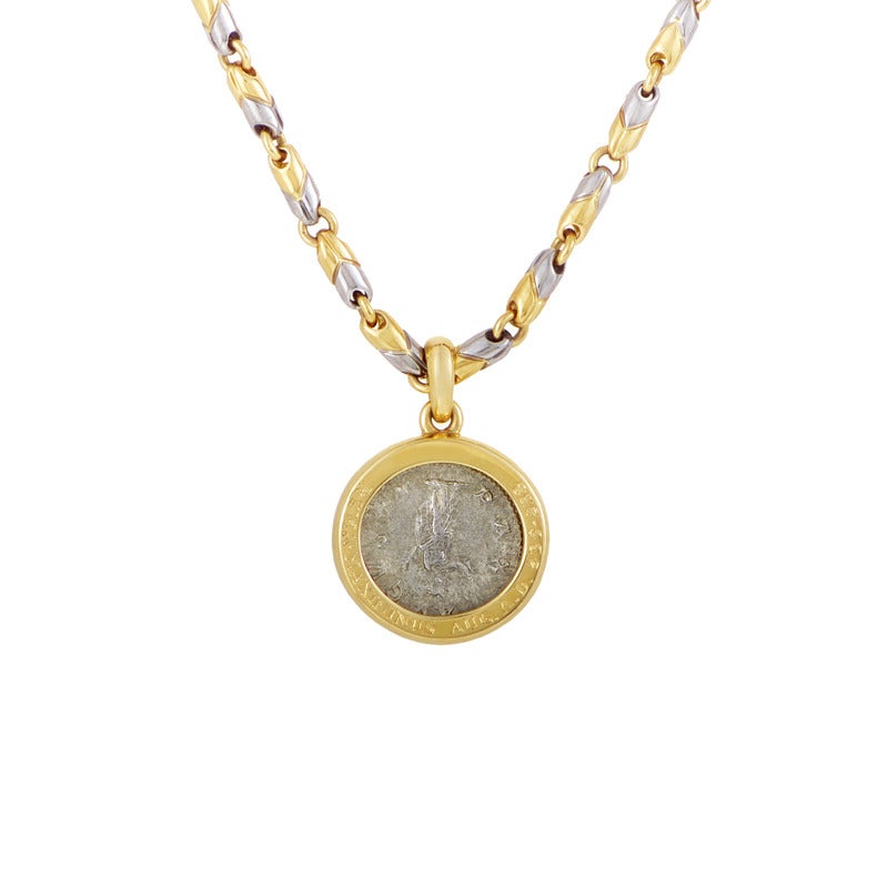 A truly harmonious, gleaming combination of 18K yellow gold and stainless steel constitutes the imaginatively-designed, smoothly-flowing chain of this splendid necklace from Bulgari with an ancient coin as a pendant.

Approximate Dimensions: Drop