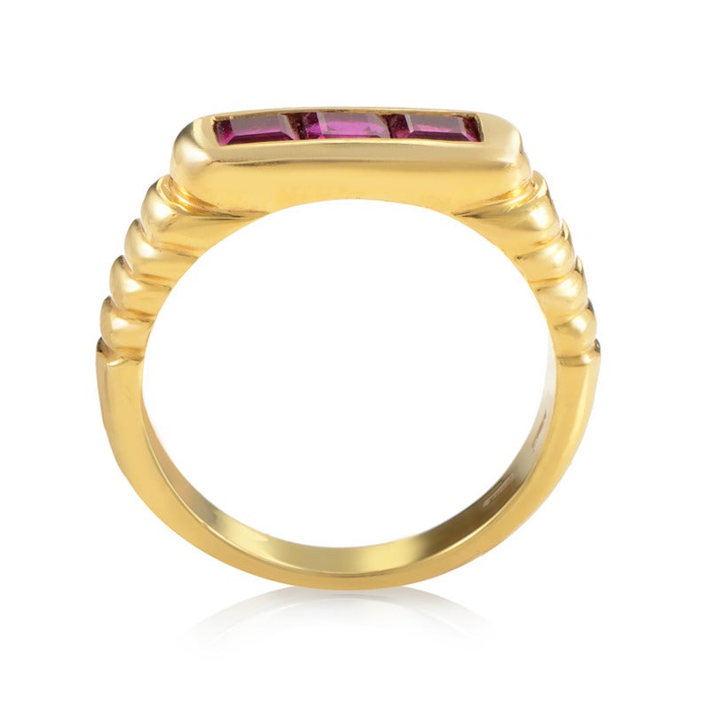 Harmoniously combining direct opposites, this charming 18K yellow gold ring from Bulgari features a smooth, partially fluted body and marvelous rectangular ruby stones on top.

Ring Size: 6.25 (52 1/8)