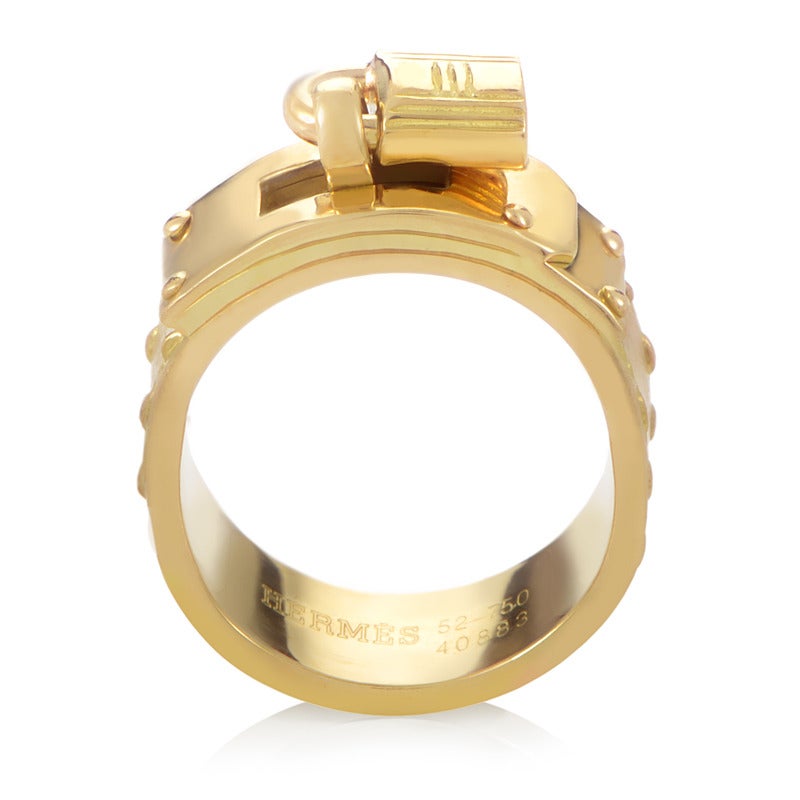 Made entirely of polished, shimmering 18K yellow gold and designed in a creative, daring manner, this exquisite band from Hermes features a striking decoration in the shape of a traditional lock.

Ring Size: 5.0 (49)