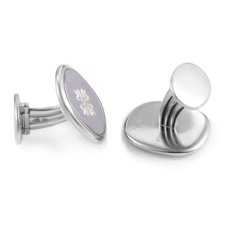 Honoring the principles of understated elegance, these neat cufflinks from Patek Philippe boast a stunningly classic look with a brilliantly stylized arabesque décor.