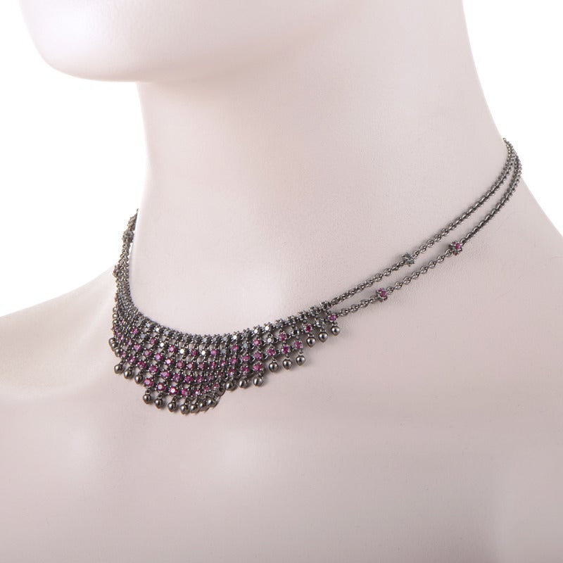 The truly dazzling, imaginative design of this gorgeous necklace by Paul Morelli uses a striking combination of black rhodium-plated 18K white gold and 3.00 carats of rubies, embellished further with 1.50 carats of diamonds.
