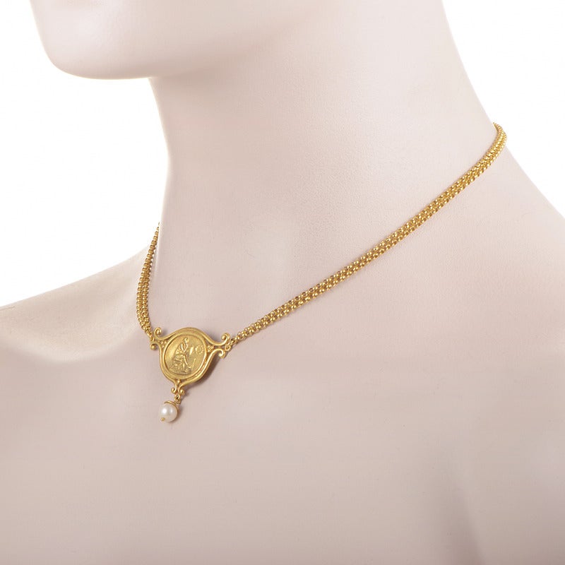Edging rather close to an authentic, antique look, this magnificent 18K yellow gold necklace from SeidenGang boasts an elegant pendant with imaginative decoration, while a glaring white pearl hangs below.
Approximate Dimensions: Length: 15.75