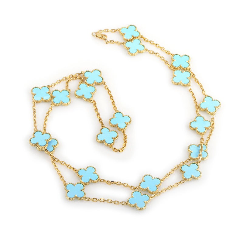 Combining harmoniously the pastel tone of turquoise stones with the vibrant shine of 18K yellow gold, this memorable necklace from Van Cleef & Arpels features handsomely-shaped decorations on its slim chain.

Approximate Dimensions: Drop of the