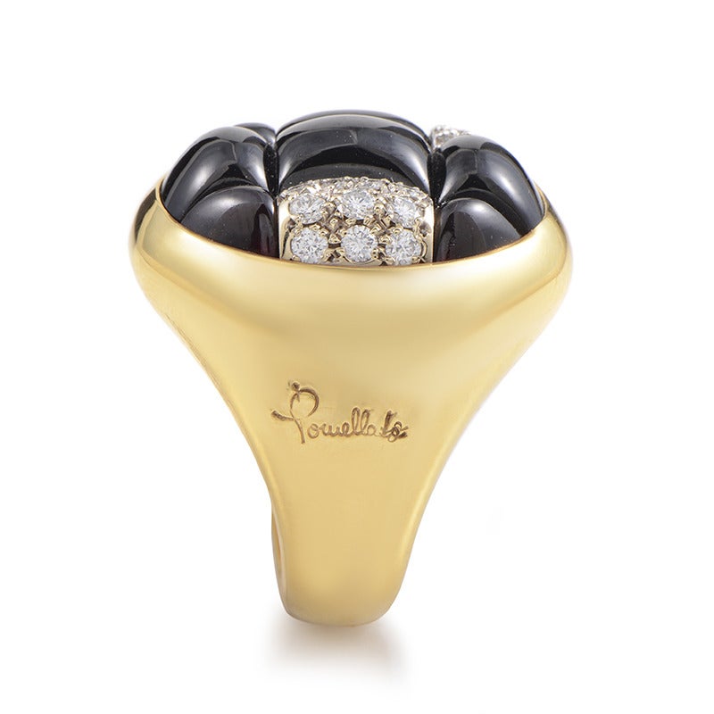 Bold and futuristic in design, this Pomellato ring is sure to garner much attention. The ring is made of 18K yellow gold and is set with garnet cabochons as well as .31ct of diamonds.

Included Items: Manufacturer's Box
Ring Size: 7.0 (54)