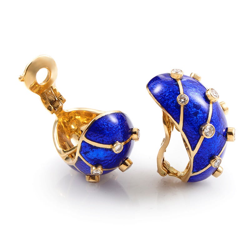 Boasting striking blue enamel accented effectively with gorgeous diamond stones, these Tiffany & Co. earrings from the Schlumberger collection offer a bold, memorable look. The pair is made of attractive 18K yellow gold accompanying wonderfully the
