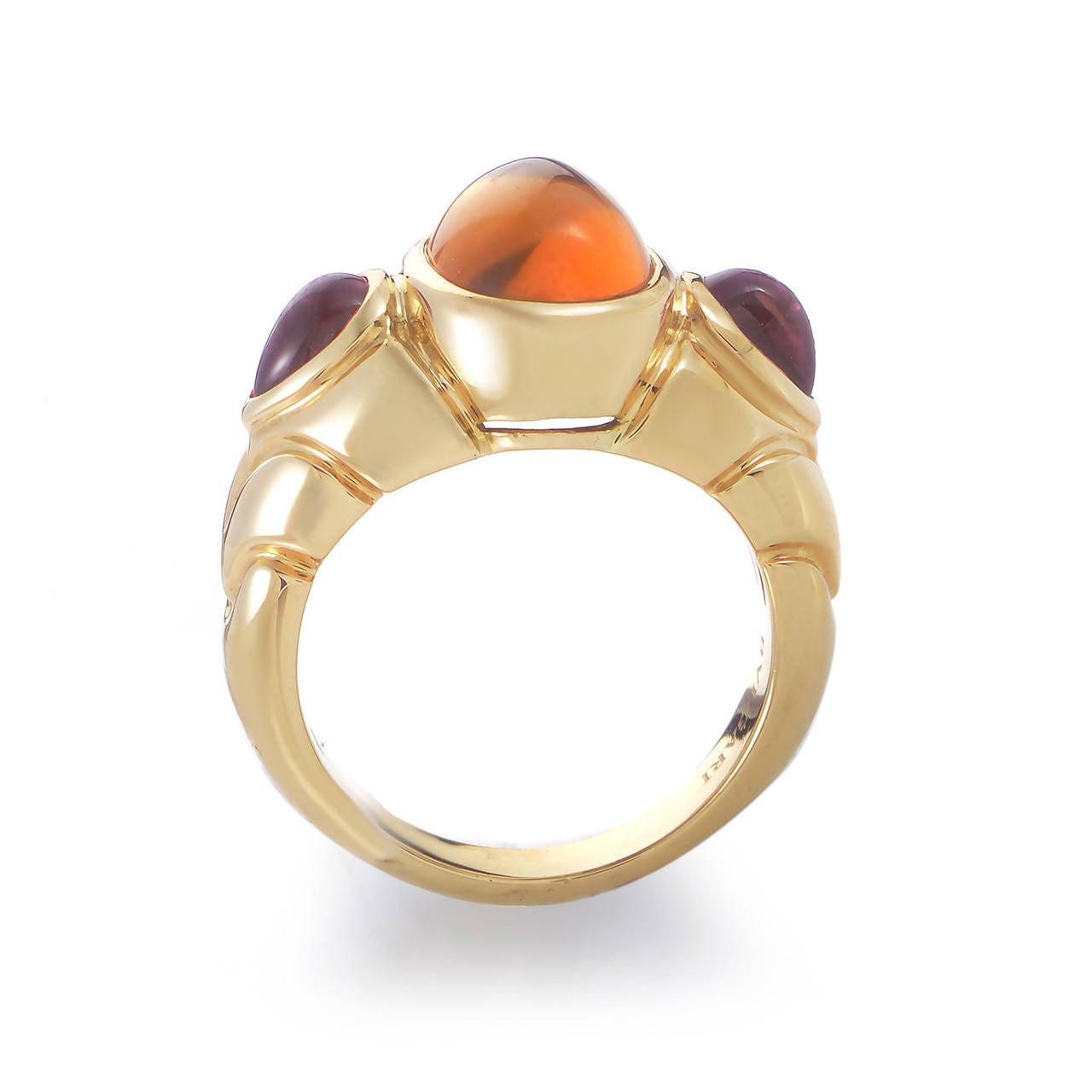 With the memorable carvings on the 18K yellow gold body characteristic for the brand, this fantastic ring from Bulgari boasts a warm, delightful combination of two pink tourmalines and a stunning citrine stone on the top.
Ring Size: 6.25 (52 1/8)
