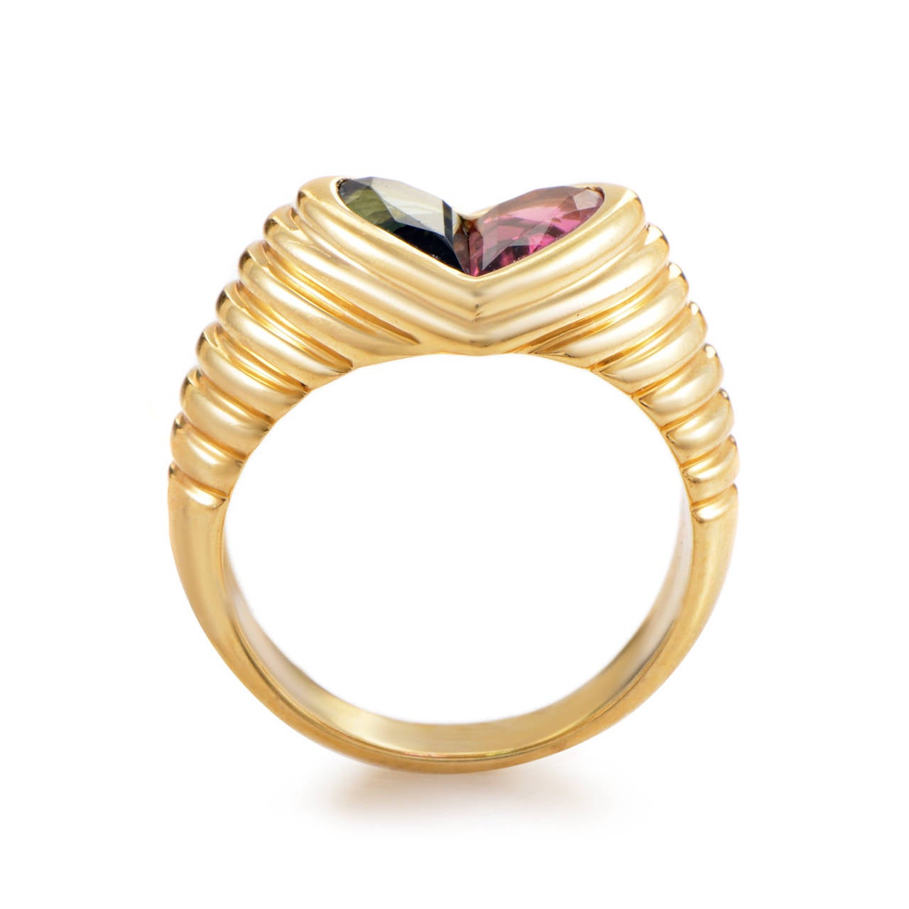 Take your fashion to the next level with this simple yet stylish Bulgari 18K yellow gold diamond ring. Adorned with most dazzling green and pink tourmaline stones, this ring will make you stand out in the crowd.
Included Items: Manufacturer's