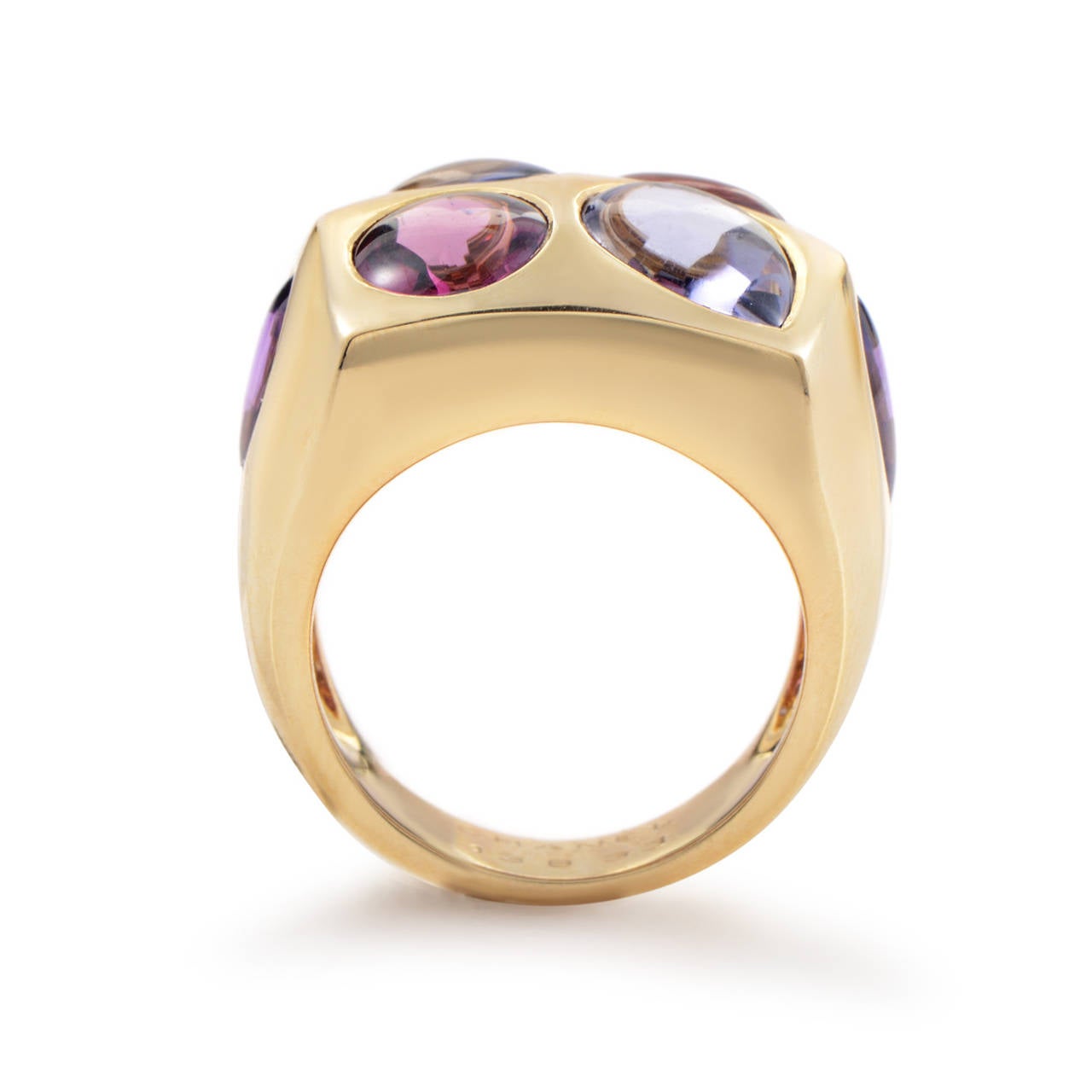 This gorgeous ring from Chanel shines with beauty and elegance. The ring is crafted from 18K yellow gold and boasts brilliant amethyst, iolite and tourmaline enhancements that serve to accentuate the enduring beauty and allure of polished 18K yellow