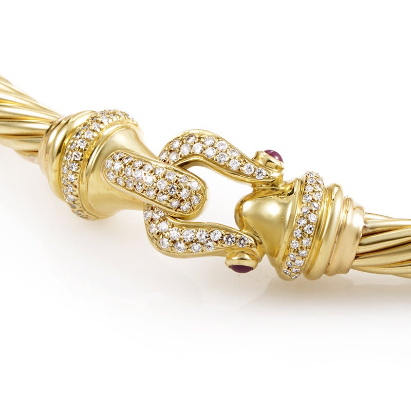 Comprised of a number of delicate, slim 18K yellow gold strings entwining to create an almost hypnotic form, this majestic necklace by David Yurman boasts an impressive decoration set with exactly 1.00 carat of diamonds along with two gorgeous